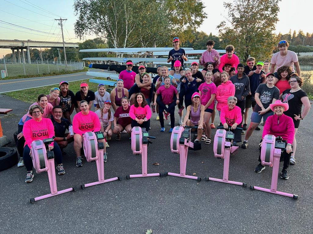 pink ribbon row sitting on rowing machines